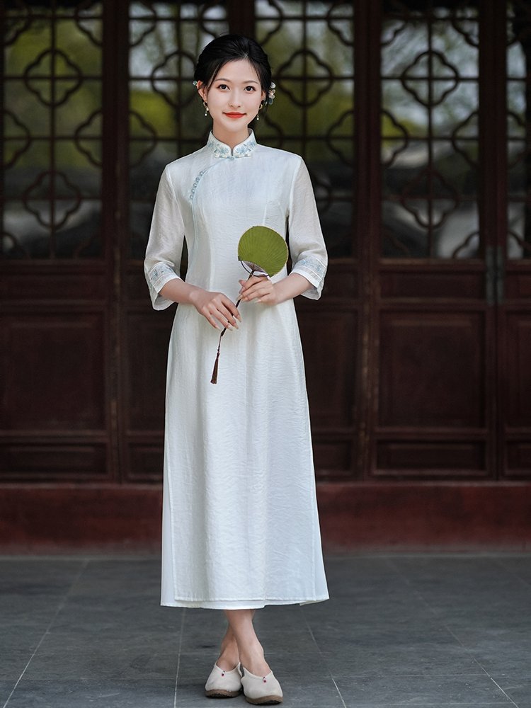 Woman standing in Misty Blue Mandarin Collar Hanfu Dress