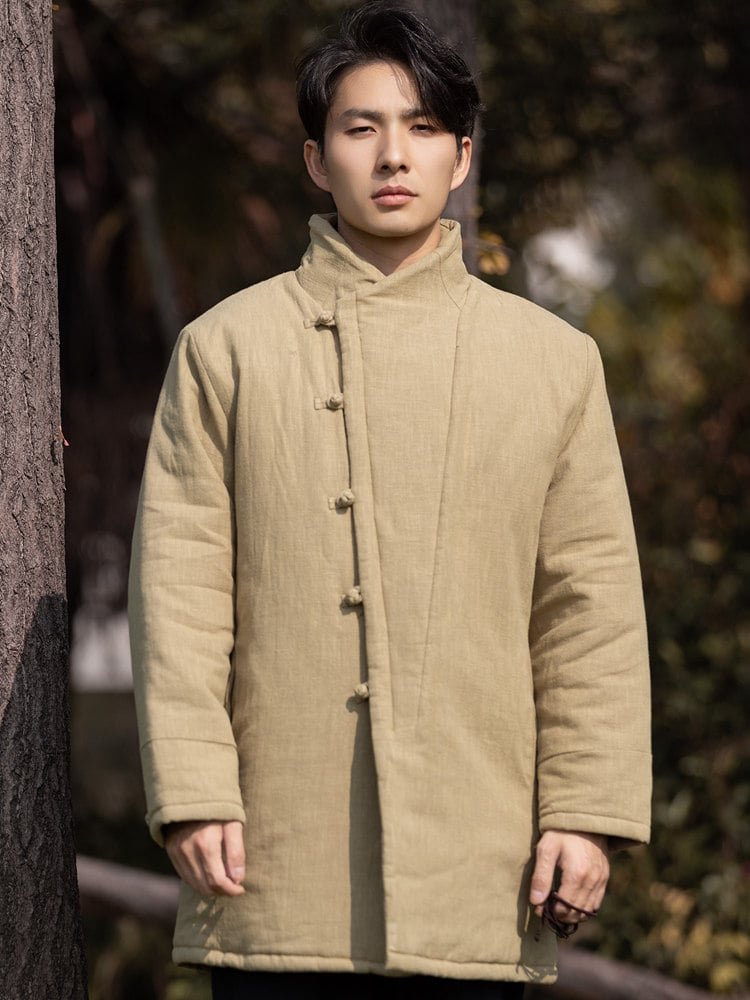 Model wearing an autumn leaf yellow men’s Chinese winter Tang jacket with frog buttons, front upper-body view.