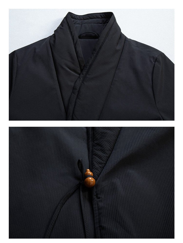 Close-up detail of the collar and crossover tie closure on a black Chinese wrap winter jacket.