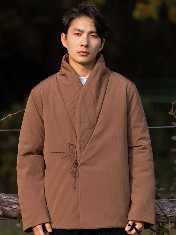 Side-front view of a brown Chinese wrap winter jacket showing the crossover front and tie closure.