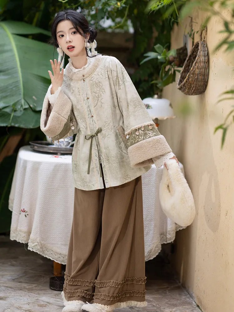 Side pose of woman wearing Mist Bamboo Hanfu top and pants.