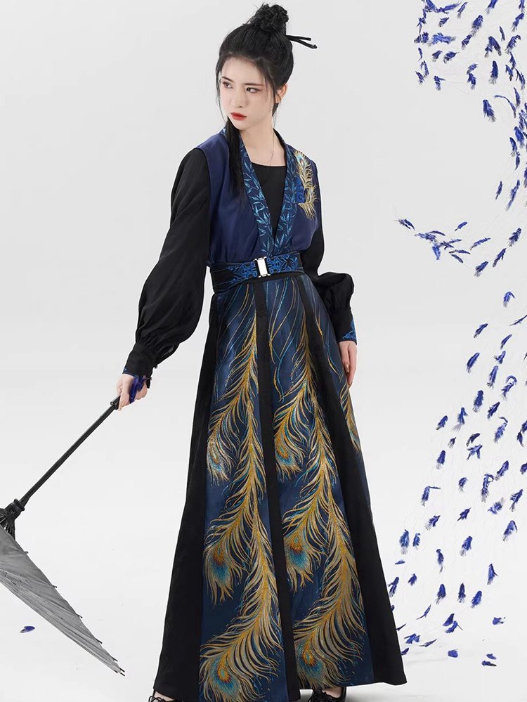 Model posing in embroidered peacock dress with parasol