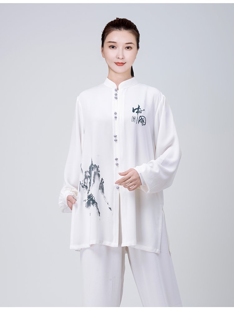 Model standing in white Tai Chi outfit with mountain embroidery