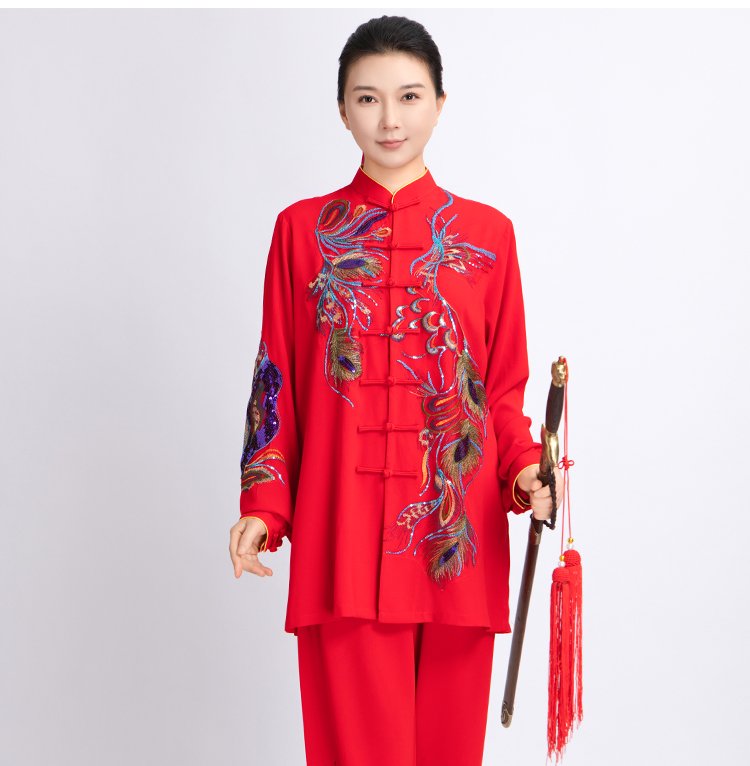 Martial artist performing Tai Chi wearing red embroidered uniform