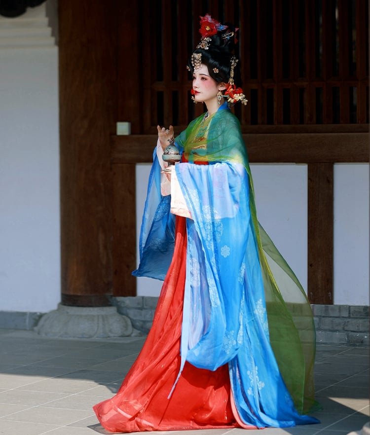 Blue-top, red-skirt Tang-style ruqun Hanfu with wide sleeves and elegant drape.