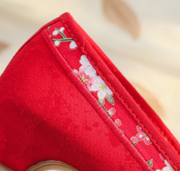 Red embroidered Hanfu shoes with butterfly pattern