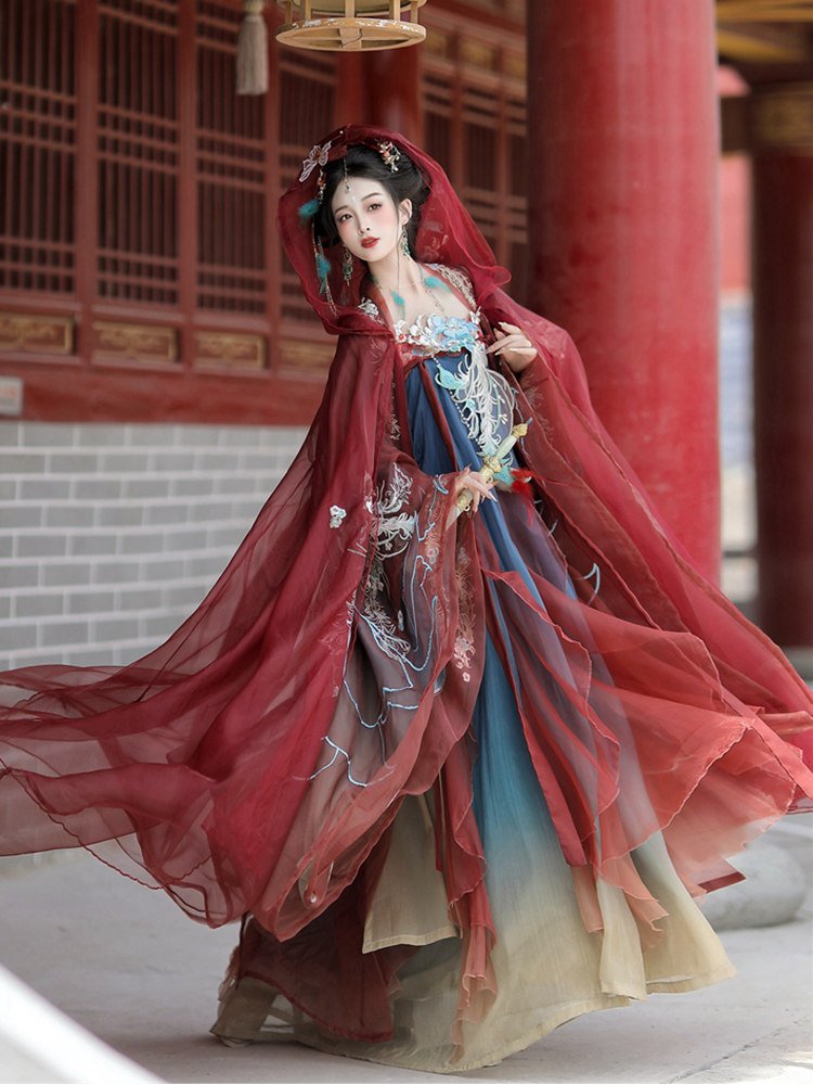 Model wearing red and blue gradient phoenix Hanfu dress