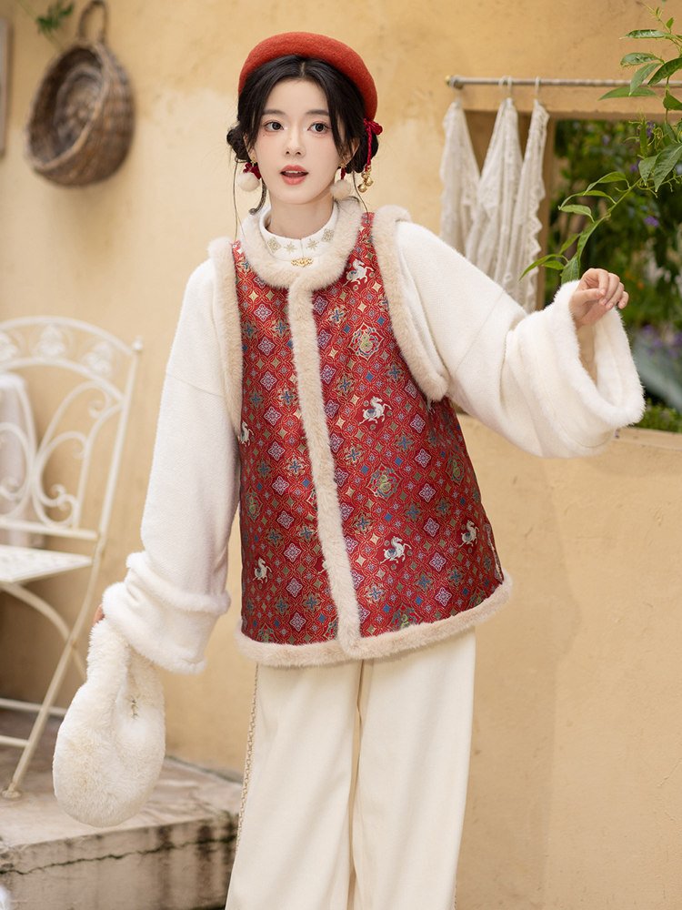 Red vest styled with winter pants and top