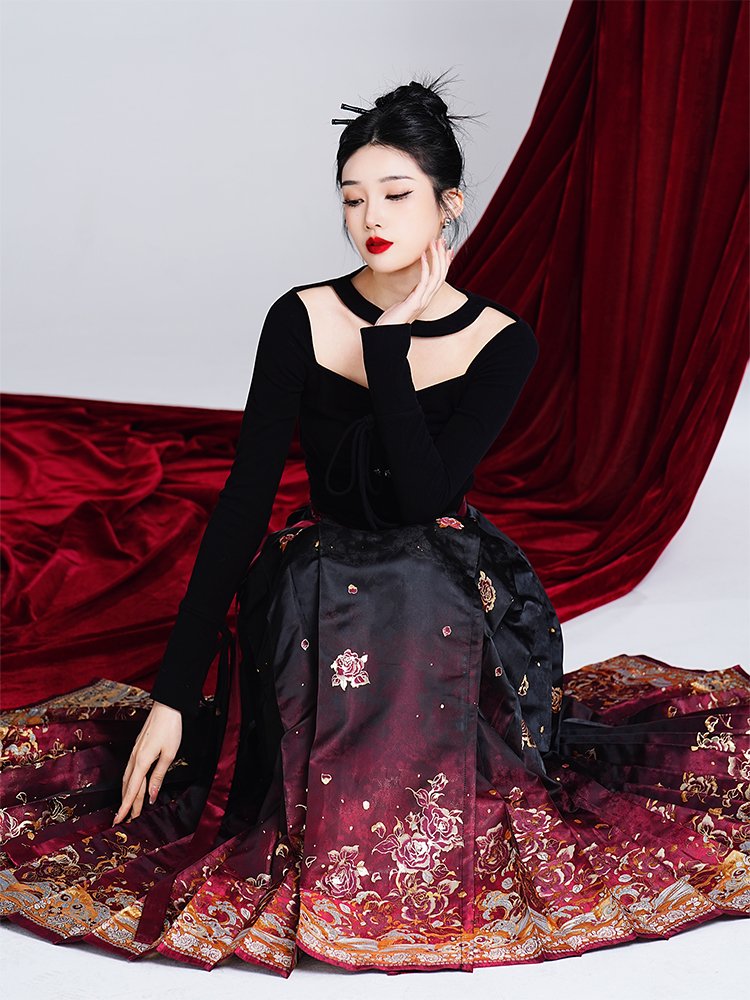 Model seated, displaying the full spread of the ombré Ma Mian skirt