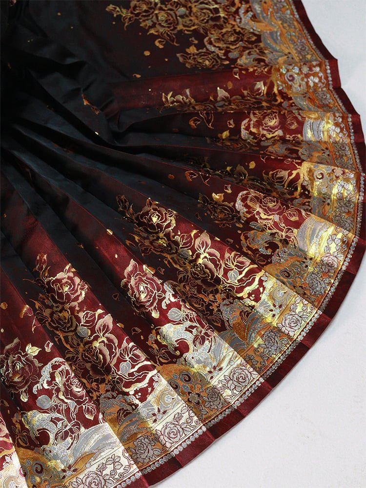Close-up of ombré Ma Mian skirt showing gold-thread rose brocade