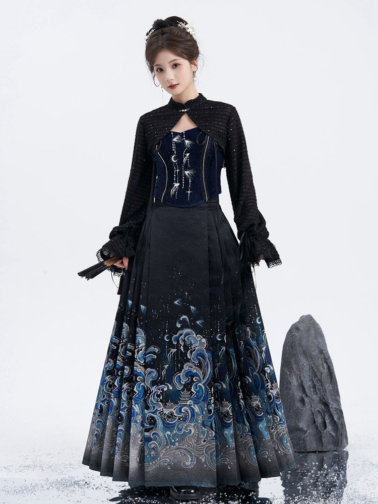 Model in three-quarter pose wearing sea-wave ma mian skirt with embroidered bodice.
