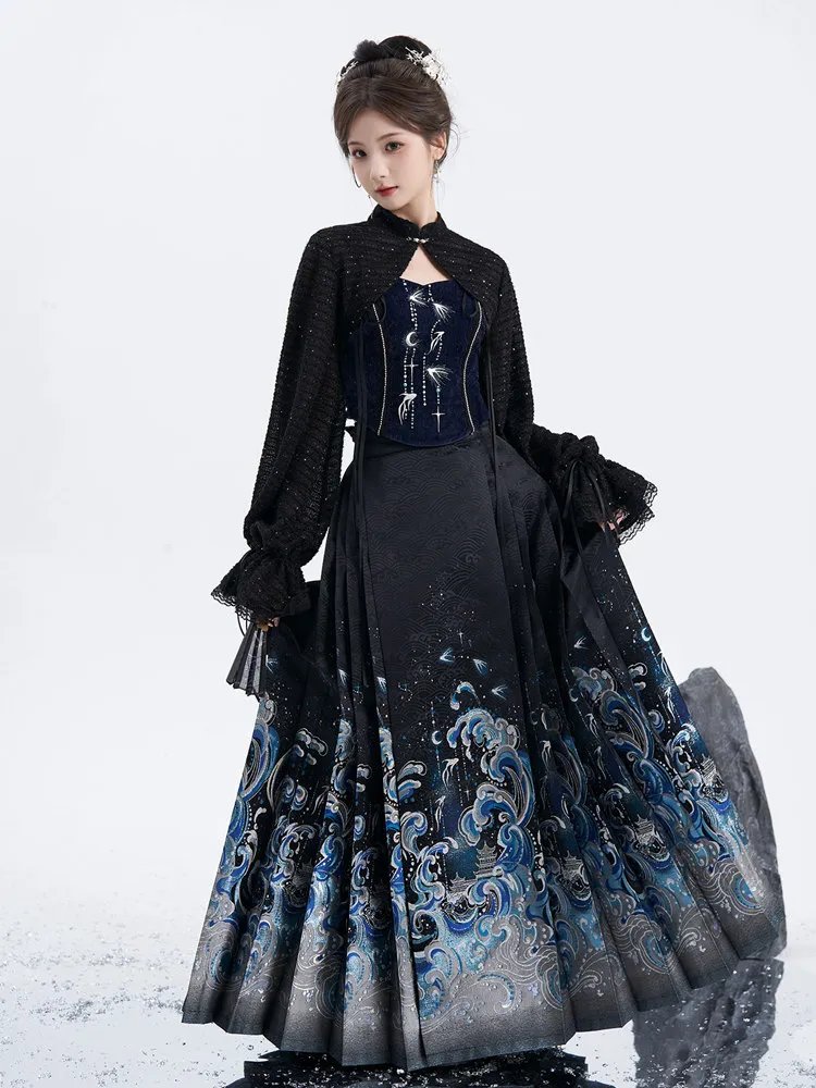 Model wearing ocean-wave brocade ma mian skirt with black outer jacket, front full-body view.