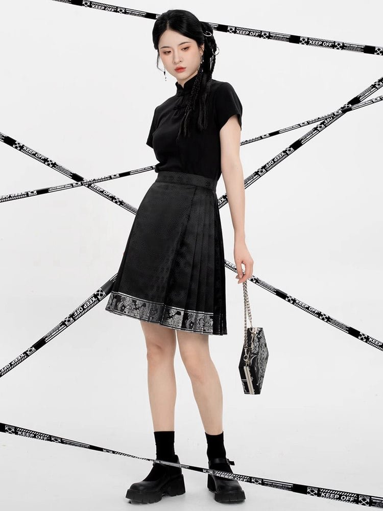 Model walking in a silver hem short mamian skirt, showing movement and flare.