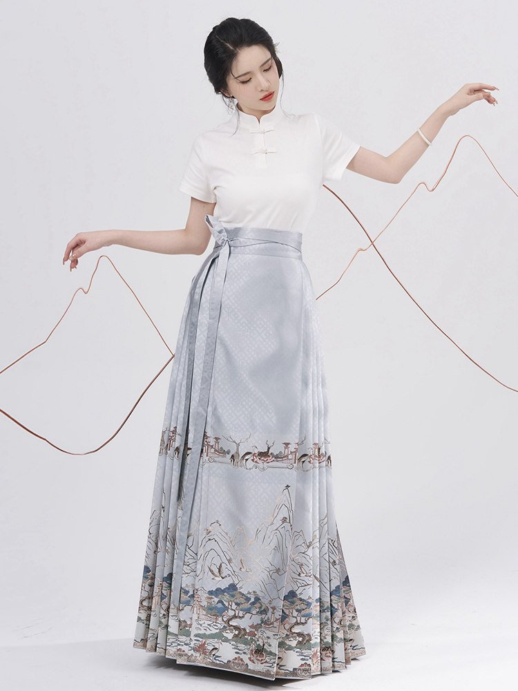Model wearing blue Ma Mian skirt paired with a short-sleeve white T-shirt