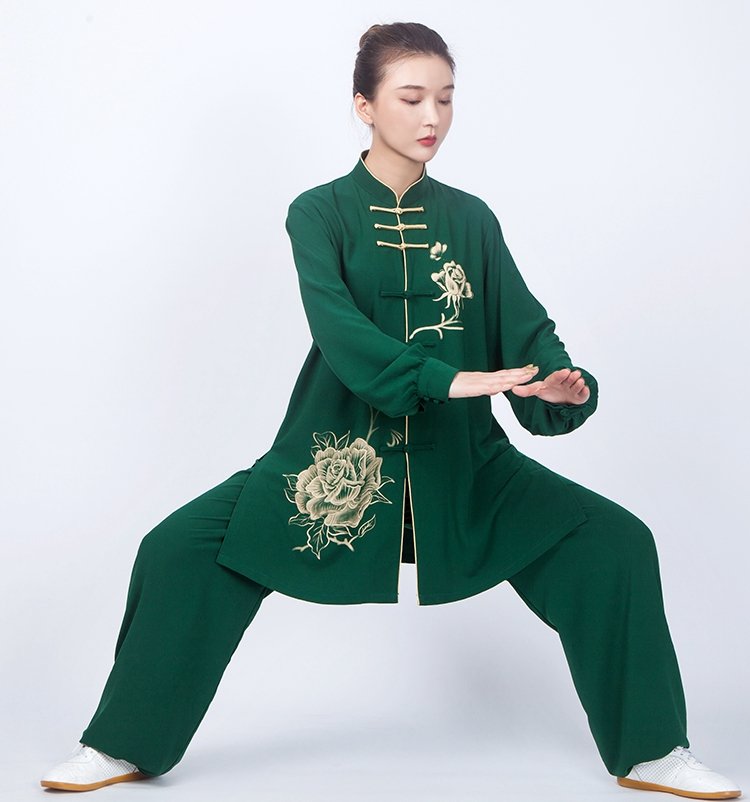 Model practicing Tai Chi in green floral uniform