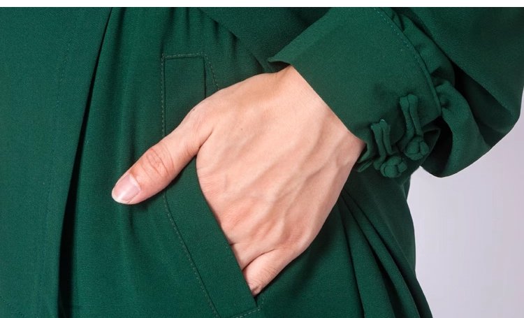 Close-up of elastic cuff design on green Tai Chi outfit