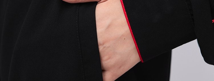 Close-up of side slit on embroidered Tai Chi jacket