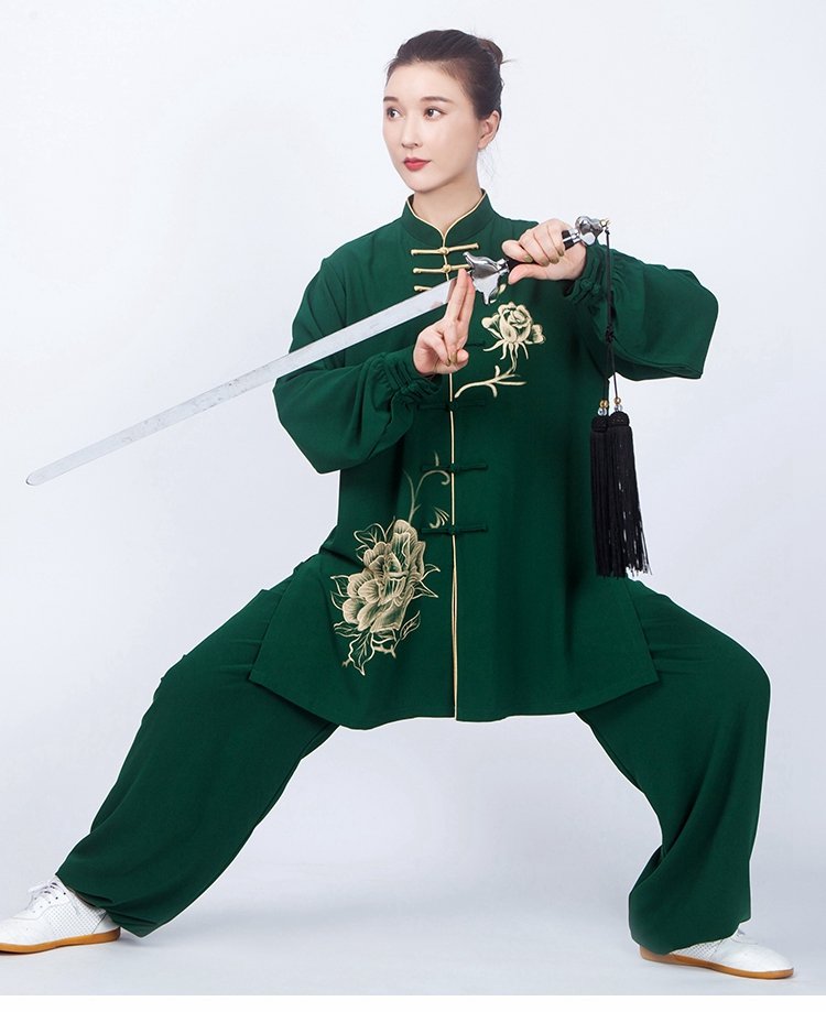 Model performing sword movement in peony print Tai Chi outfit