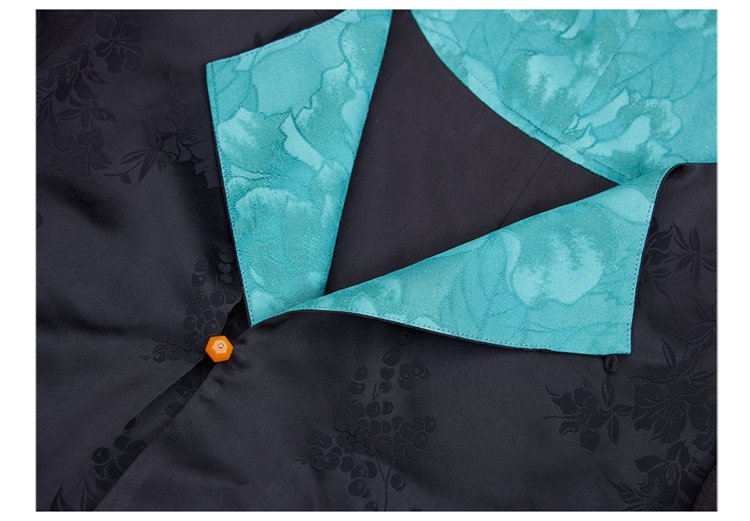 Black jacquard fabric with teal collar detail on tang-style hanfu