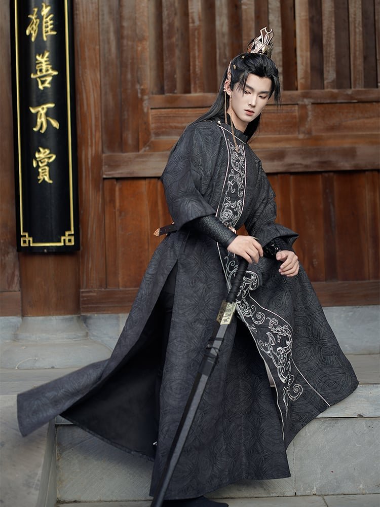 Side view of Tang-style men’s Hanfu robe in black with silver embroidery, flowing silhouette.