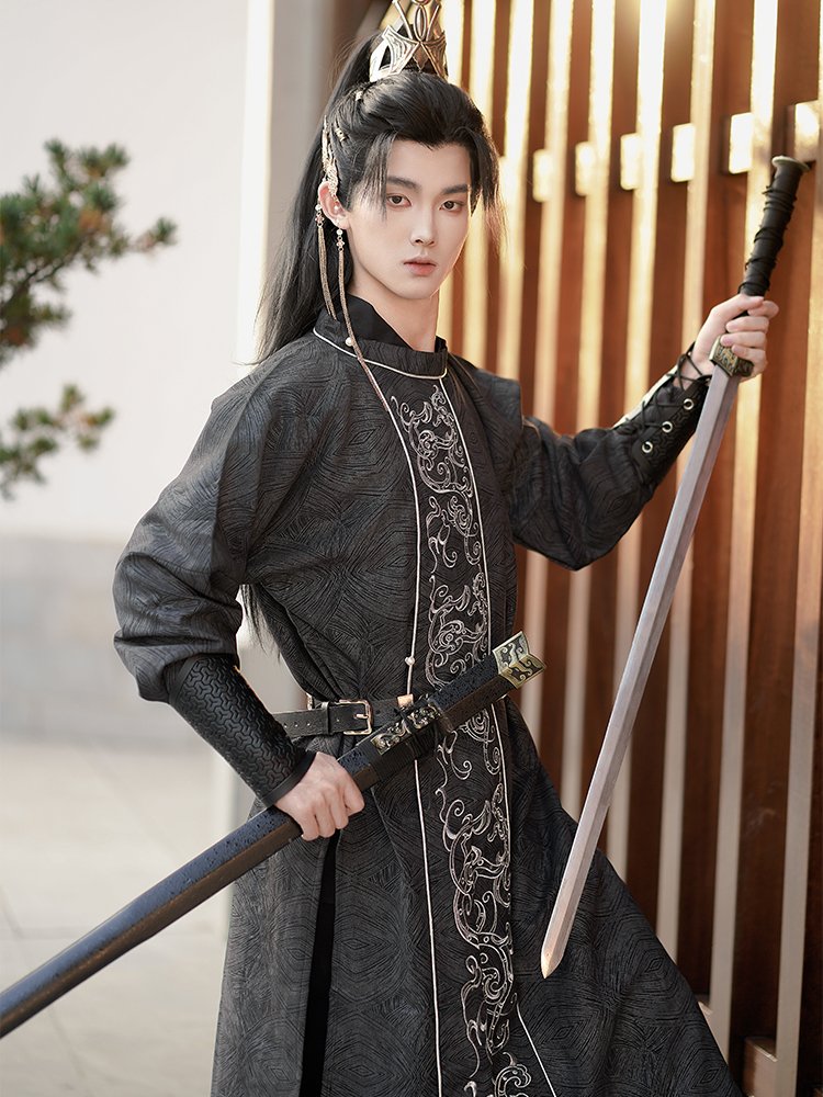 Tang-style Hanfu robe for men with silver embroidery, traditional costume photography pose.