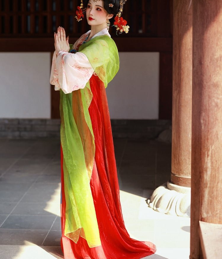 Back view of the Tang-style Qixiong ruqun Hanfu in green and red tones with wide sleeves.