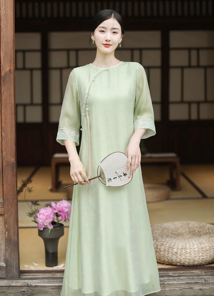 Model wearing light green Tencel Zen tea dress, front view