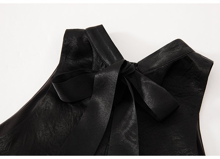 Close-up of ribbon-tied back neckline design