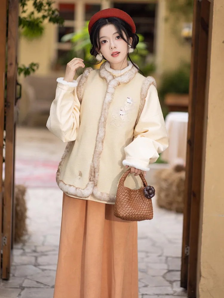 Cozy Hanfu outfit for women in soft yellow tones with fur-trimmed vest