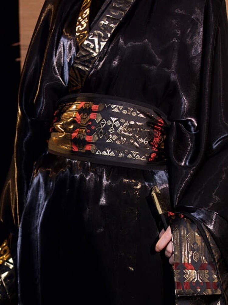 Close texture view of glossy dragon–phoenix jacquard satin Hanfu fabric.