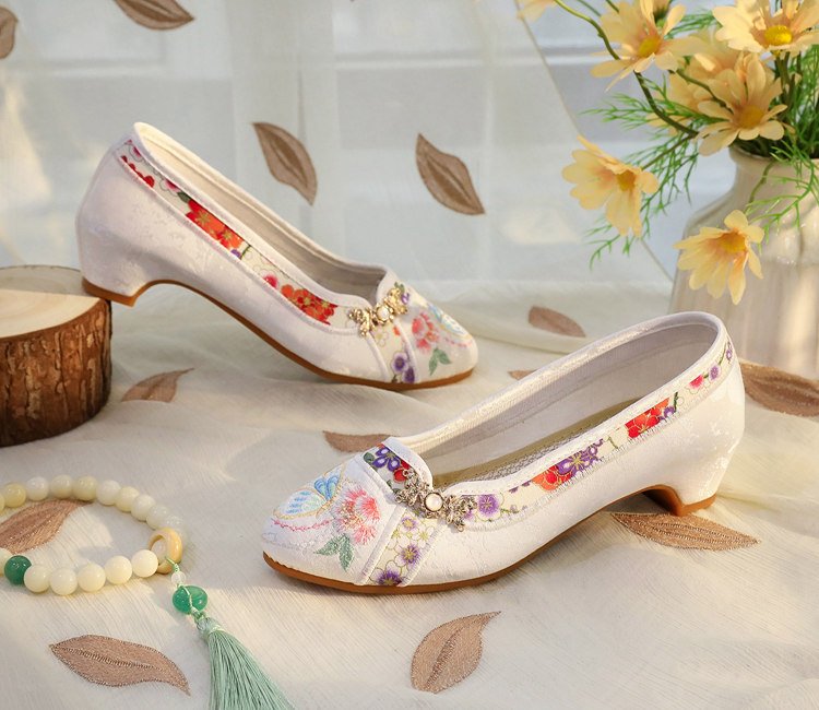 White embroidered flats with soft sole