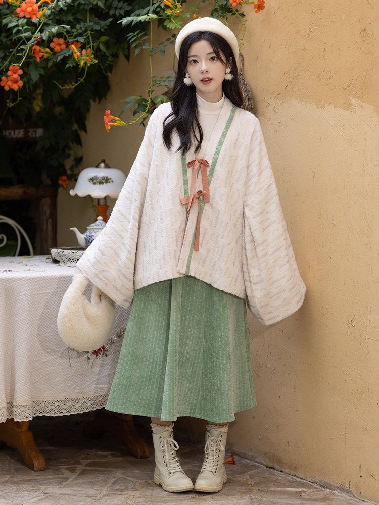 Back view of woman in fleece Hanfu jacket and corduroy skirt.