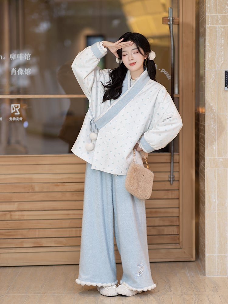 Model wearing Hanfu outfit outdoors with winter lighting