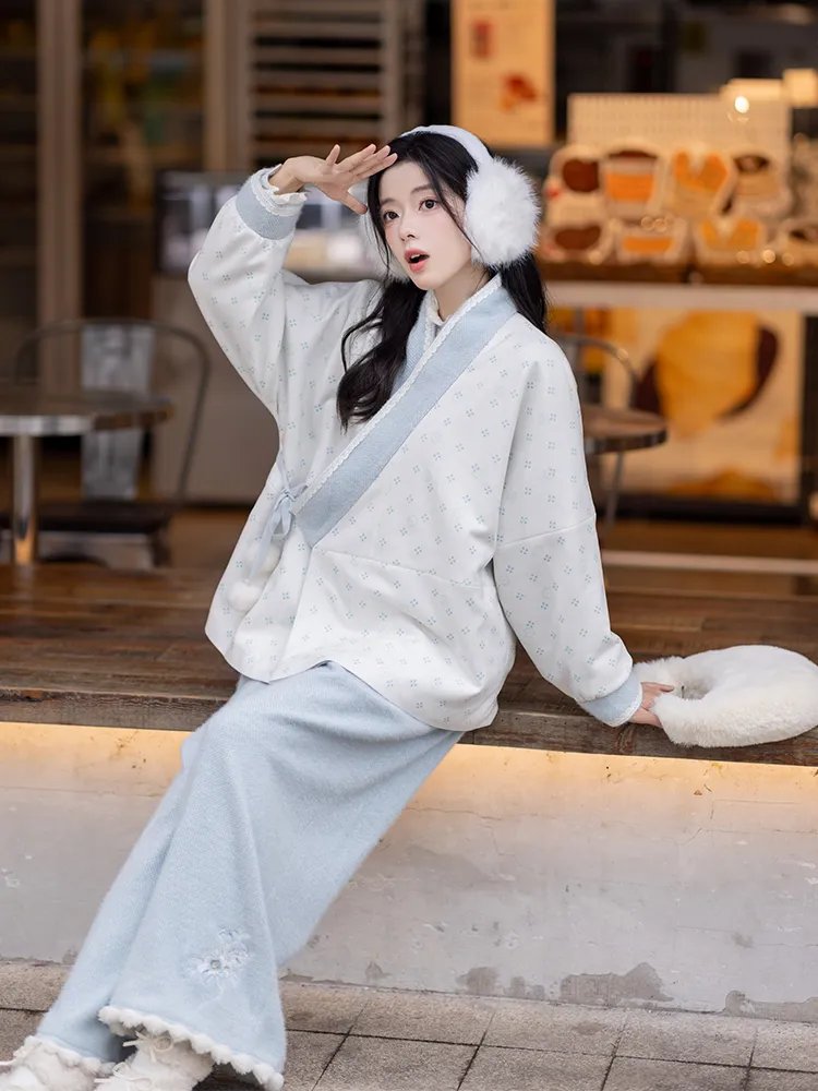 Model posing sideways in blue Hanfu outfit