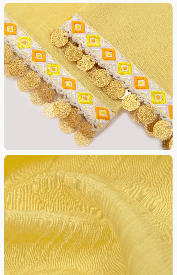 Close-up of embroidered waistband with yellow ethnic motifs