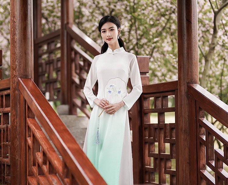 Close-up portrait of woman wearing ivory chiffon tea dress
