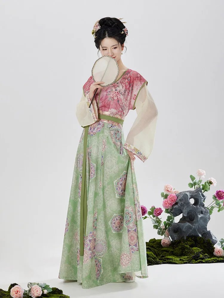 Side view of woman in Tang-style Hanfu with pink Beizi and pastel green floral skirt