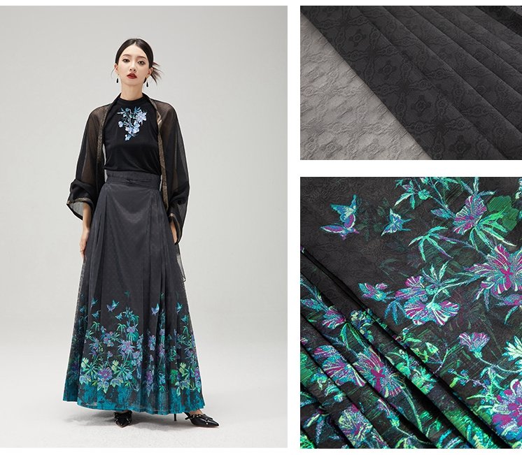 Close-up of floral embroidery and skirt pleat construction