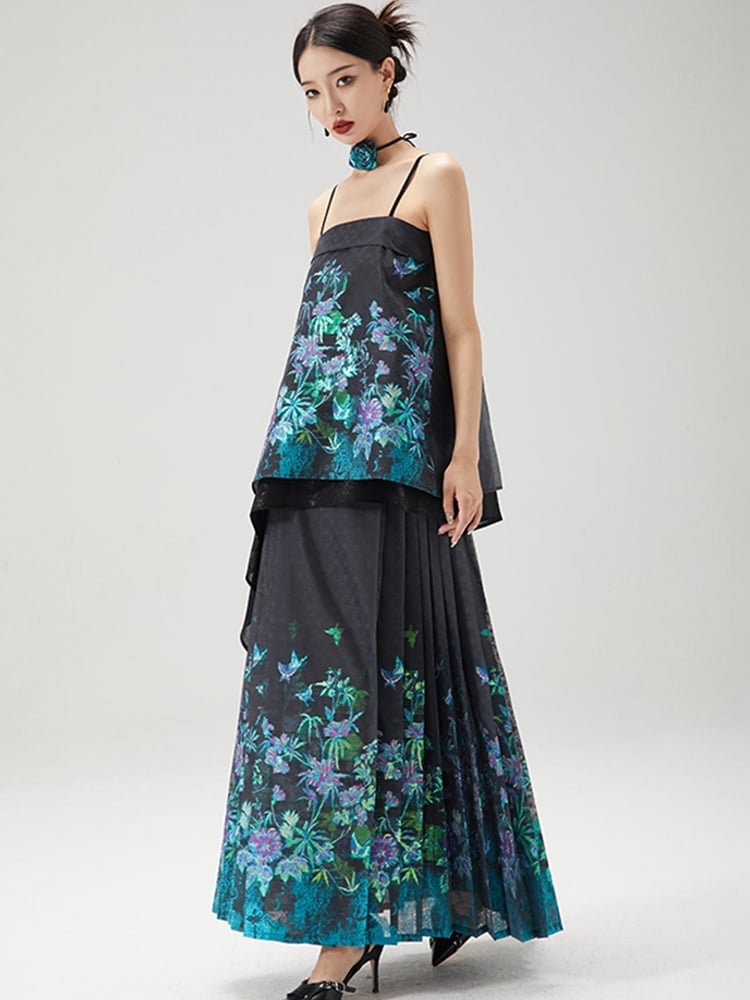 Woman wearing black layered top and turquoise floral horse-face skirt