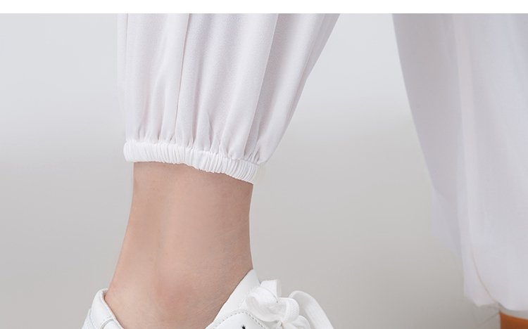 Close-up of traditional stand collar and pearl-style buttons