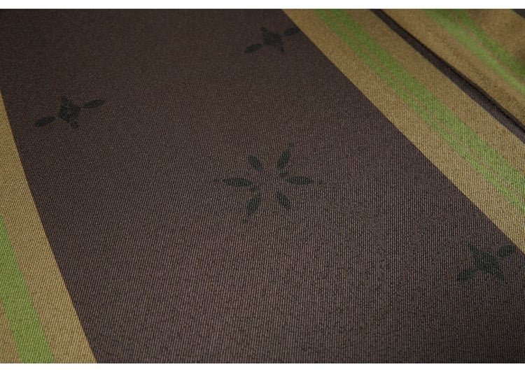 Green Hanfu fabric close-up showing printed star pattern