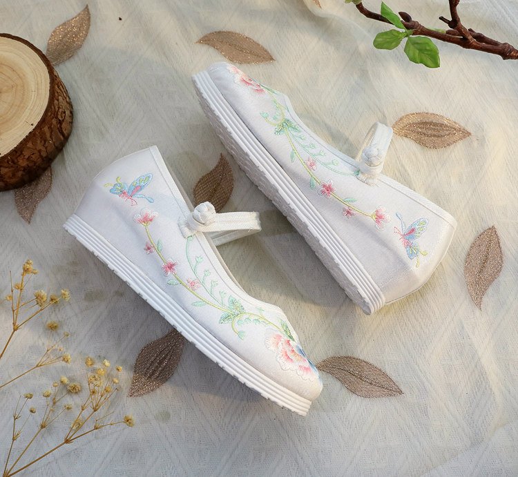 White traditional Chinese embroidered shoes with floral design