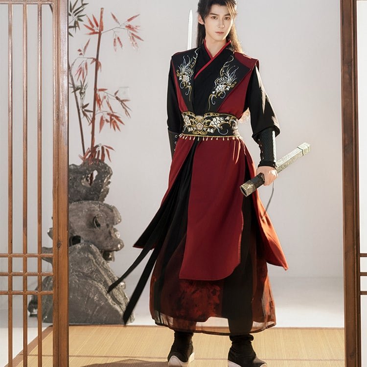 Model wearing black Wuxia-style Hanfu robe for men, striking warrior pose with sword.